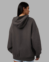 Woman wearing MVP Oversized Hoodie - Dark Storm | Model:Rhiley | Size:L