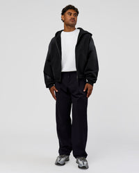 Man wearing Memory in Motion Ultra Heavyweight Zip Thru Hoodie - Black Washed | Model:Xav | Size:L