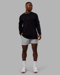 Man wearing Base FLXCotton Long Sleeve Tee - Black | Model:Sam | Size:L