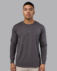 Man wearing Base FLXCotton Long Sleeve Tee - Dark Storm | Model:Kaelyb | Size:L
