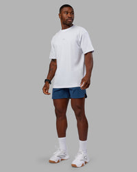 Man wearing Base FLXCotton Tee Oversized - White | Model:Sam | Size:L