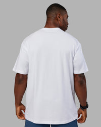 Man wearing Base FLXCotton Tee Oversized - White | Model:Sam | Size:L