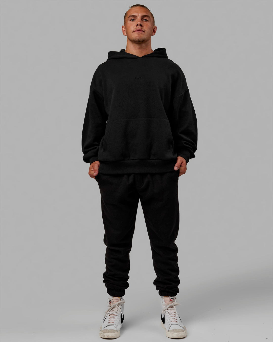 Man wearing MVP Track Pants - Black