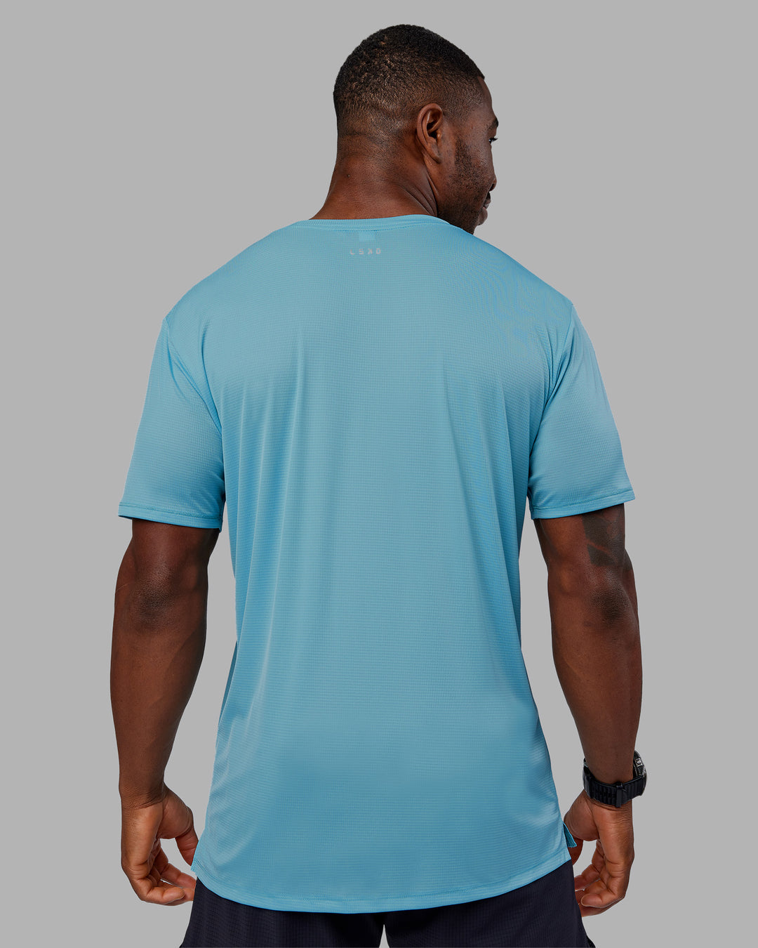 Man wearing Pace Running Tee - Retro Blue | Model:Sam | Size:L