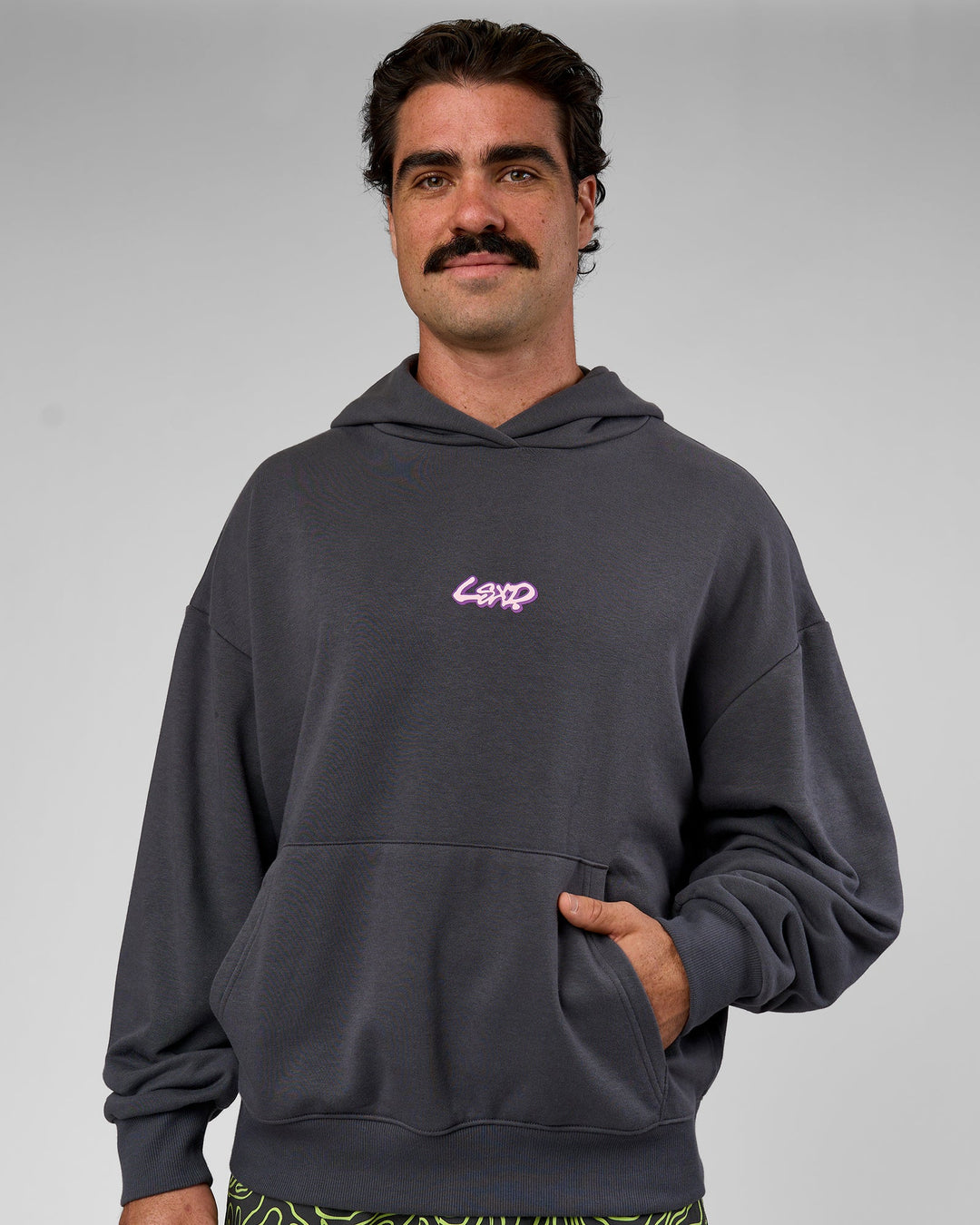 Man wearing Miami Vibe Oversized Hoodie - Dark Storm-Marshmallow | Model:Adam | Size:L