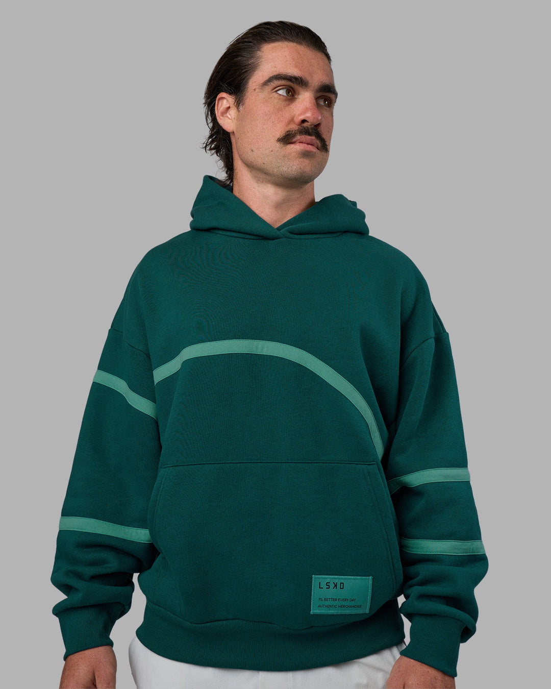 Man wearing Movement Oversized Hoodie - Dark Moss-Agate Green | Model:Adam | Size:L