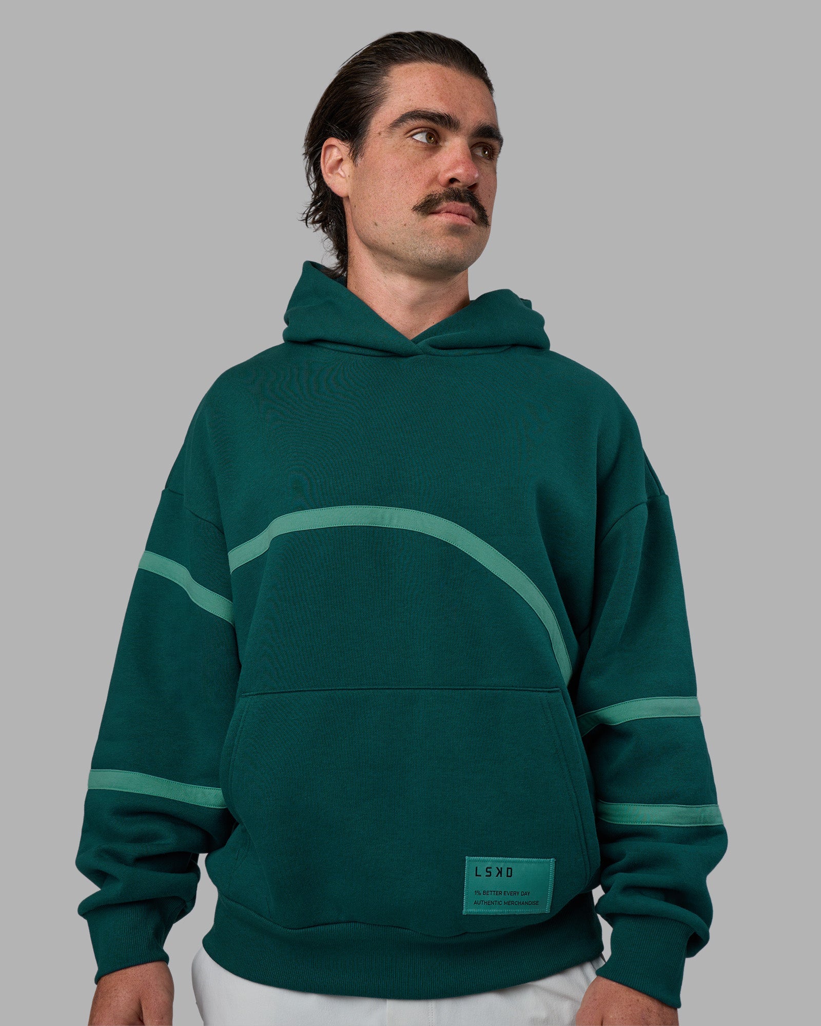 Man wearing Movement Oversized Hoodie - Dark Moss-Agate Green | Model:Adam | Size:L