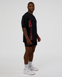 Man wearing Nothing Is Impossible FLXCotton Oversized Tee - Black-Flame | Model:Sam | Size:L