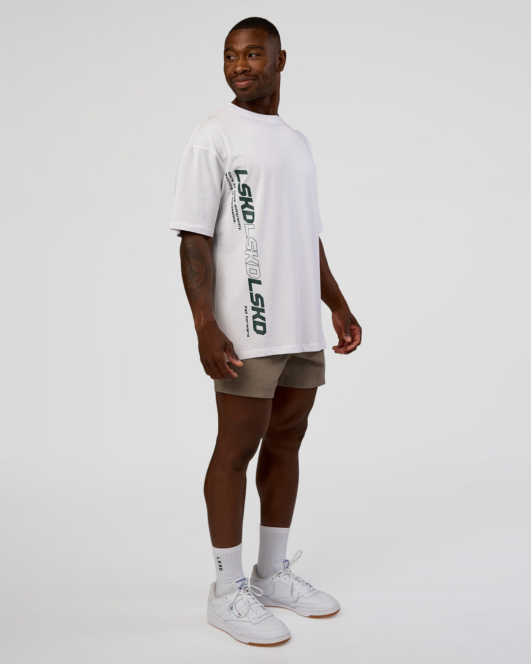 Man wearing Nothing Is Impossible FLXCotton Oversized Tee - White-Vital Green | Model:Sam | Size:L
