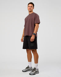 Man wearing Offset Heavyweight Unisex Oversized Tee - Cocoa Powder-Cocoa Powder | Model:Liam | Size:L