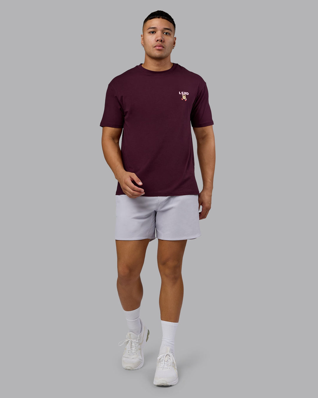Man wearing Perspective FLXCotton Oversized Tee - Cherry Lacquer-Soft Pink | Model:Kaelyb | Size:L