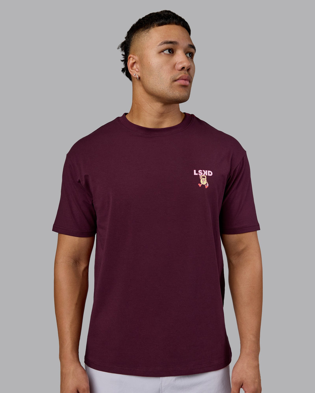 Man wearing Perspective FLXCotton Oversized Tee - Cherry Lacquer-Soft Pink | Model:Kaelyb | Size:L