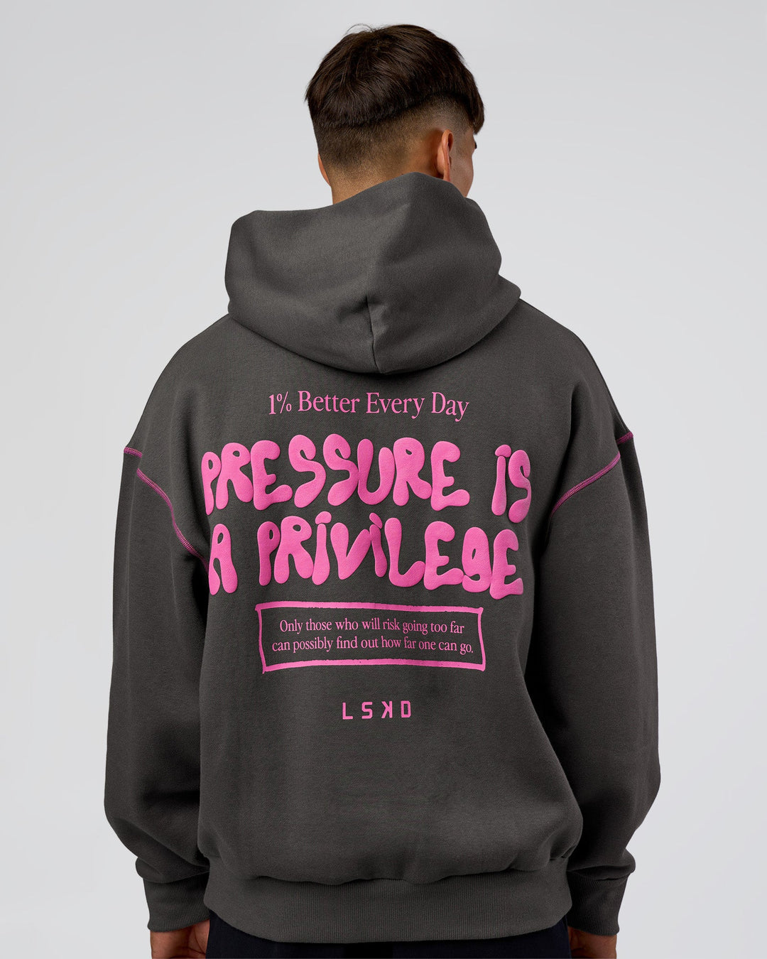 Man wearing Pressure is Privilege Oversized Hoodie - Dark Storm-Ultra Fuchsia | Model:Jackson | Size:L