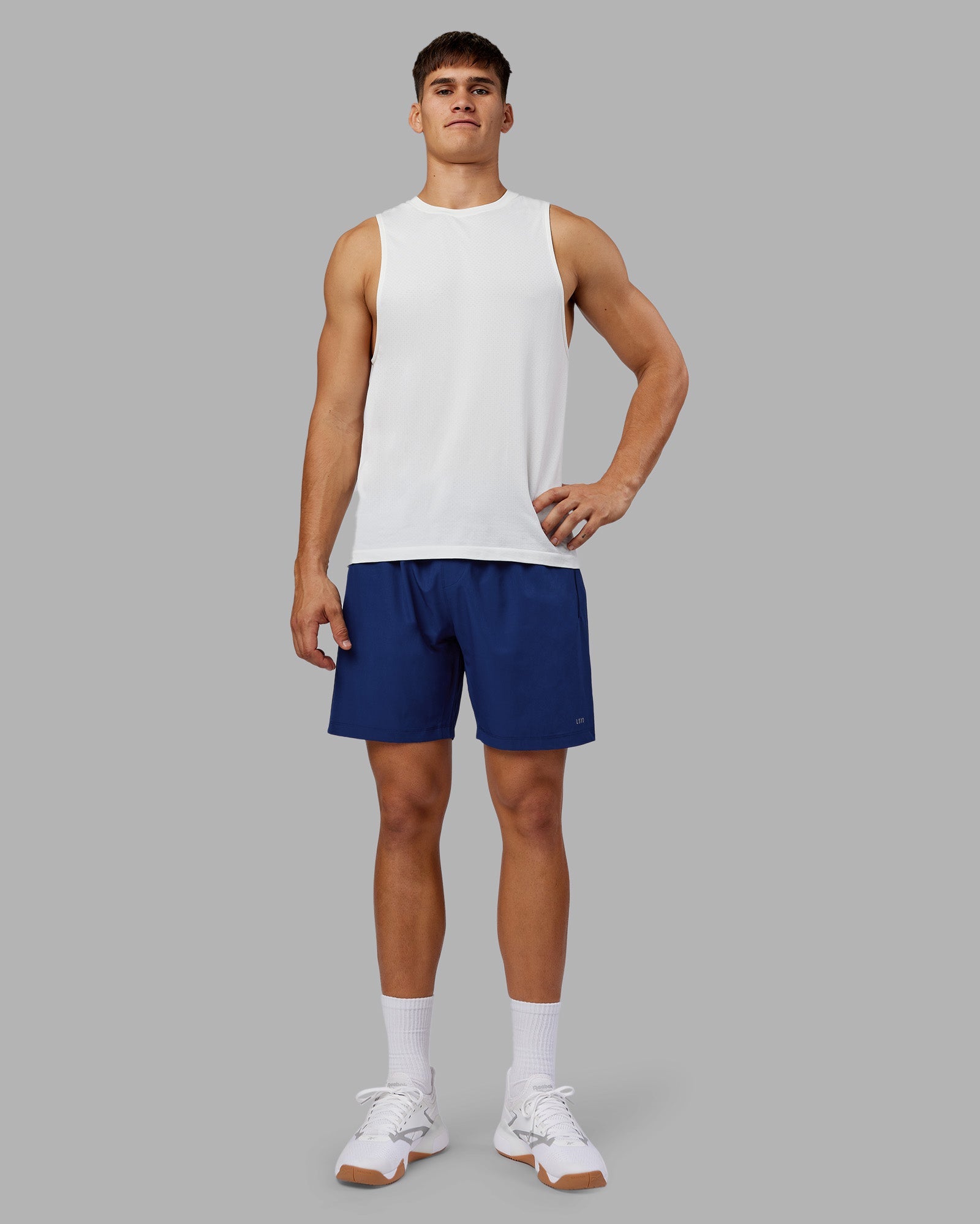 Man wearing Rep 7'' Performance Short - Midnight Blue | Model:Jackson | Size:L