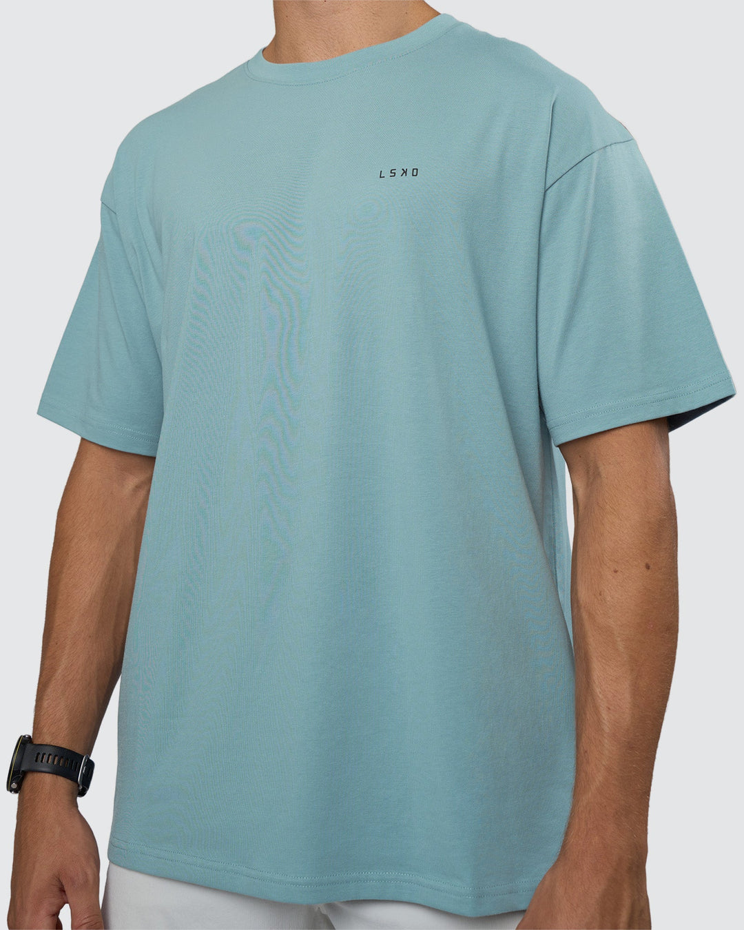 Man wearing Research Department FLXCotton Oversized Tee - Smoke Blue | Model:Nikola | Size:L