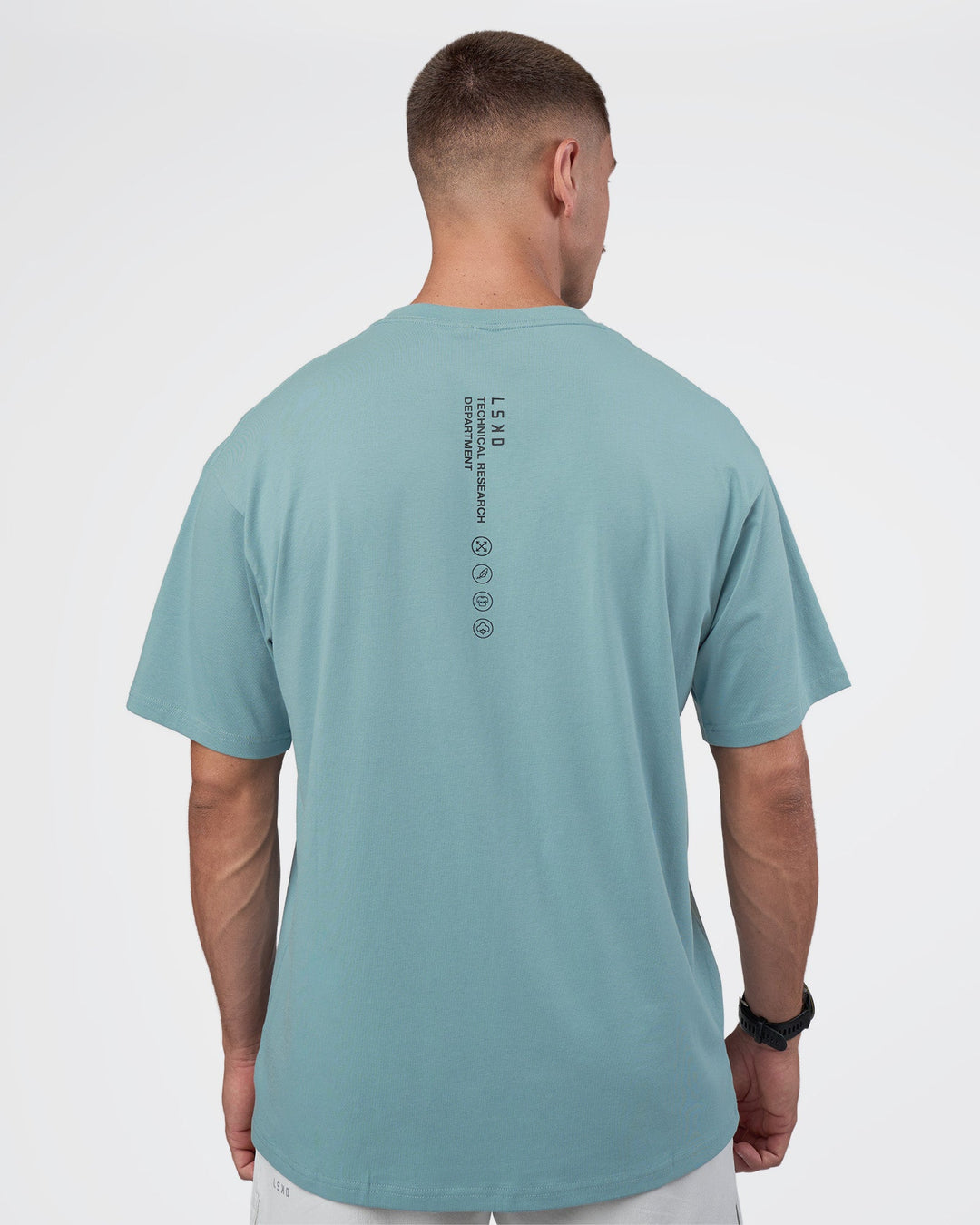 Man wearing Research Department FLXCotton Oversized Tee - Smoke Blue | Model:Nikola | Size:L