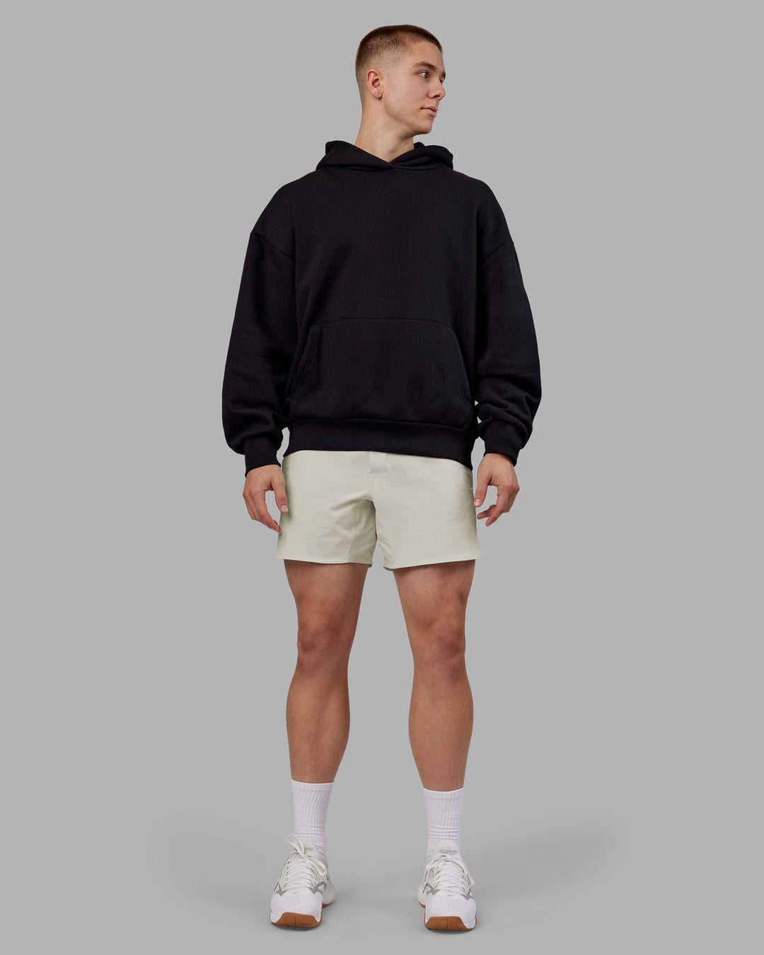 Man wearing Rise &amp; Lift Hoodie Oversized - Black-White | Model:Tom | Size:L