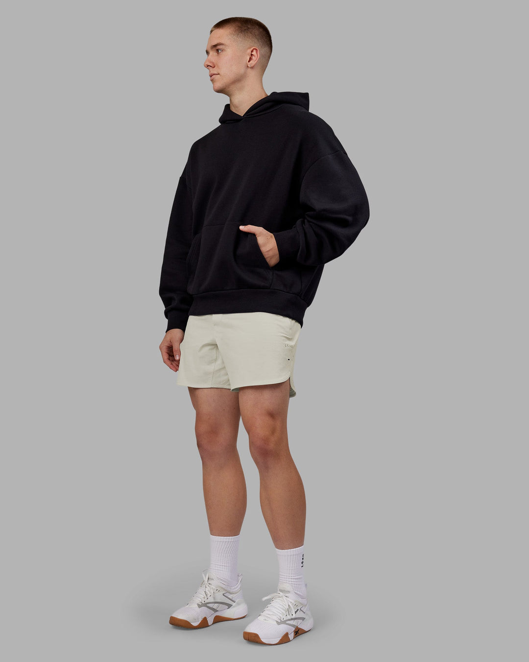 Man wearing Rise &amp; Lift Hoodie Oversized - Black-White | Model:Tom | Size:L