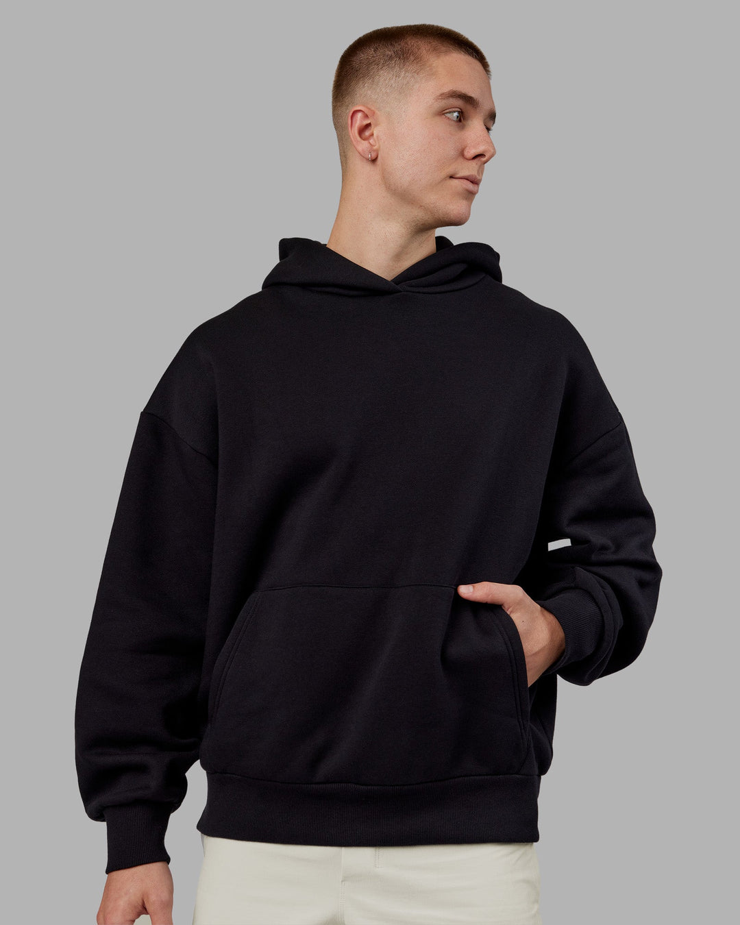 Man wearing Rise &amp; Lift Hoodie Oversized - Black-White | Model:Tom | Size:L