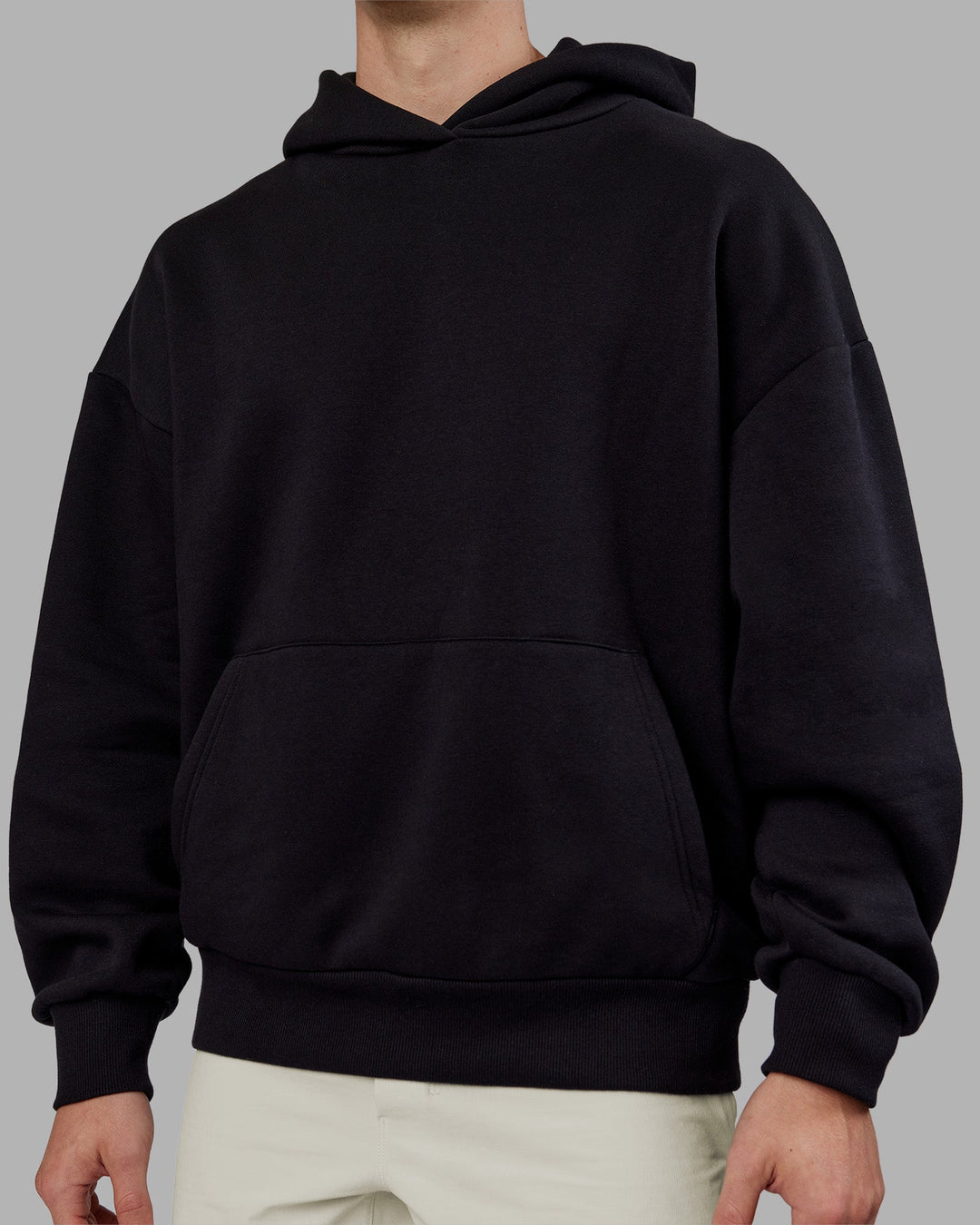 Man wearing Rise &amp; Lift Hoodie Oversized - Black-White | Model:Tom | Size:L