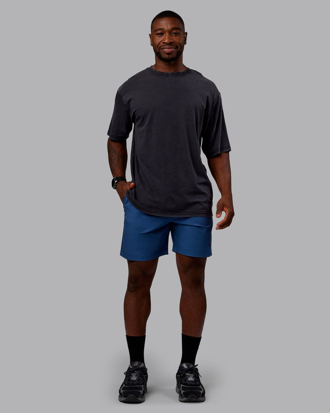 Man wearing Rise &amp; Lift Washed FLXCotton Oversized Tee - Washed Black-Indigo | Model:Sam| Size:L