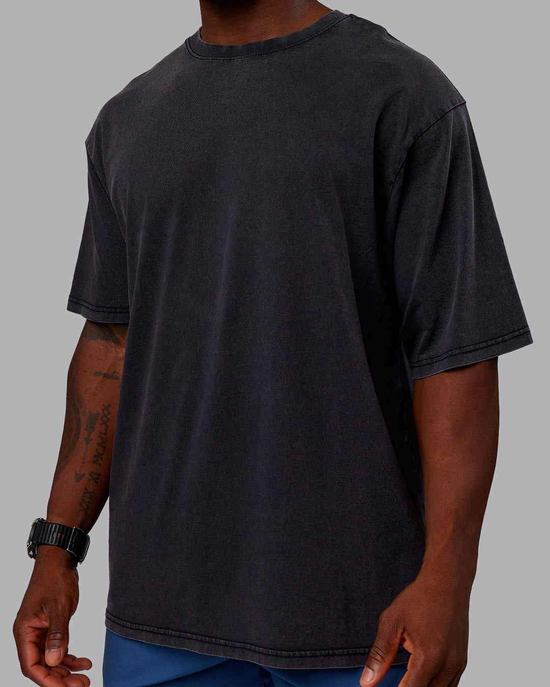 Man wearing Rise &amp; Lift Washed FLXCotton Oversized Tee - Washed Black-Indigo | Model:Sam| Size:L