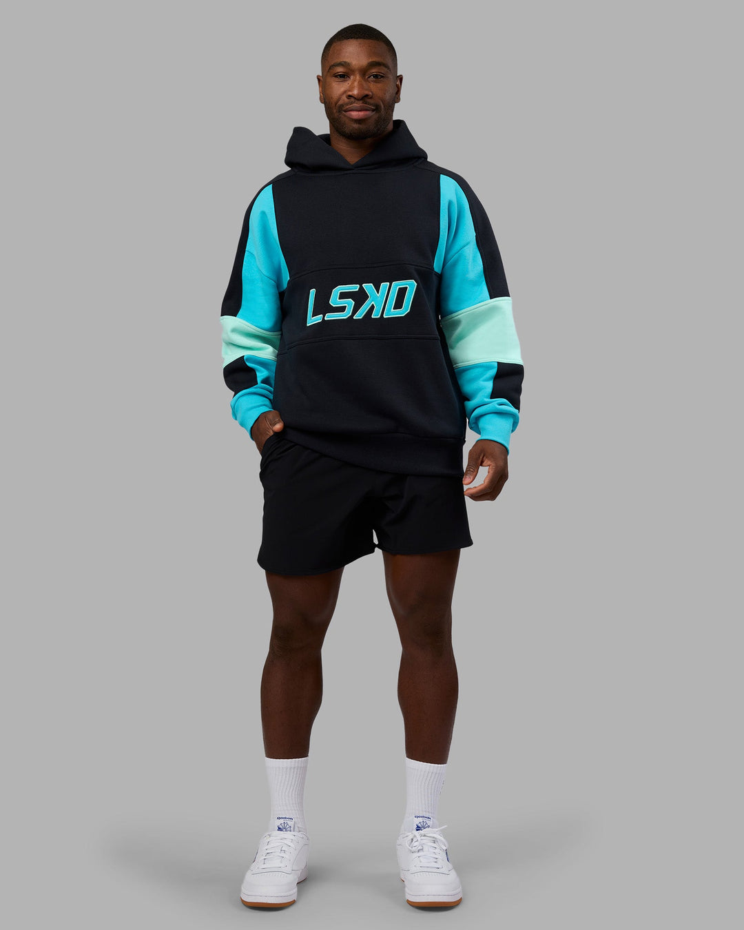 Man wearing Slam Oversized Hoodie - Caviar-Blue Atoll | Model:Sam | Size:L