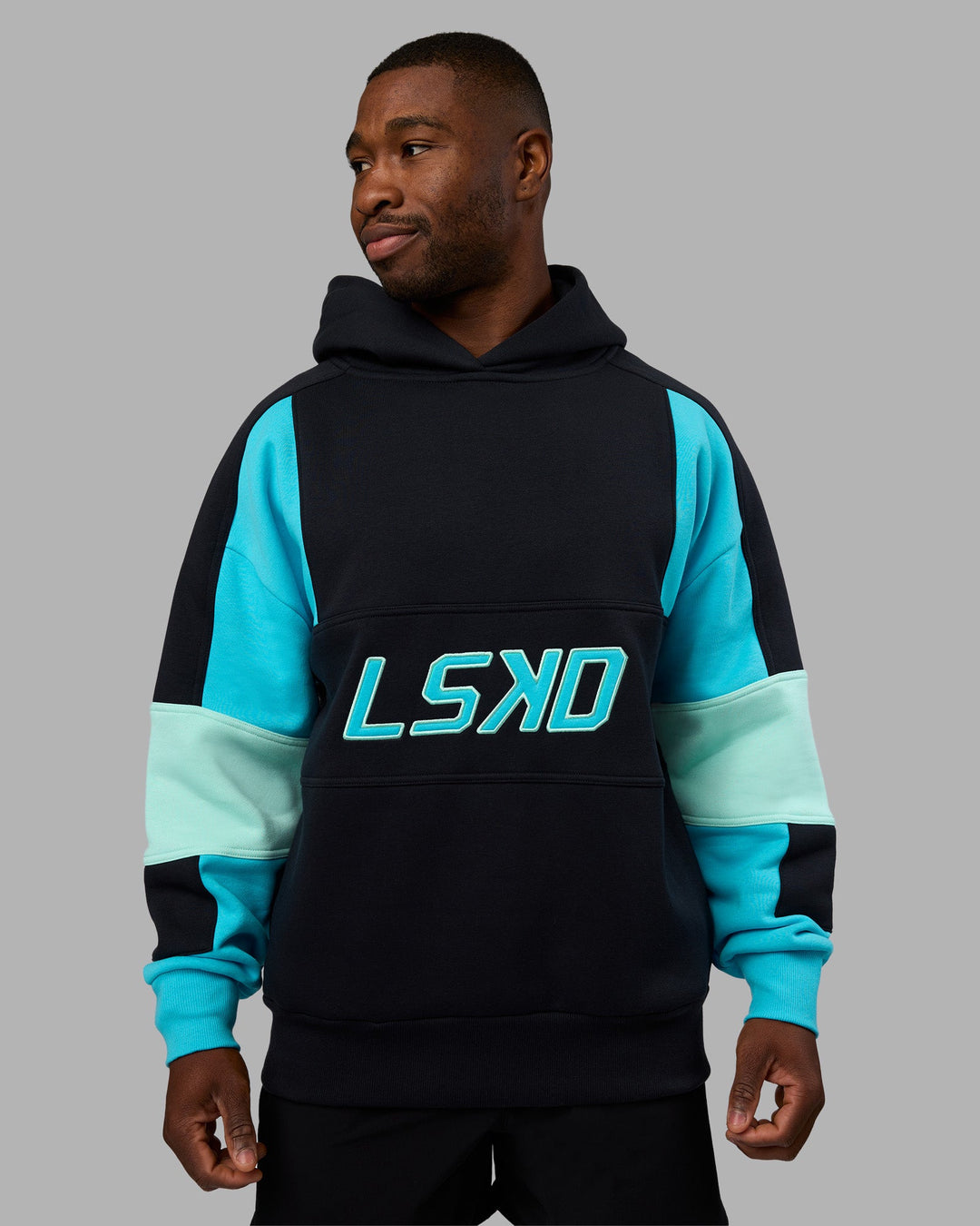 Man wearing Slam Oversized Hoodie - Caviar-Blue Atoll | Model:Sam | Size:L