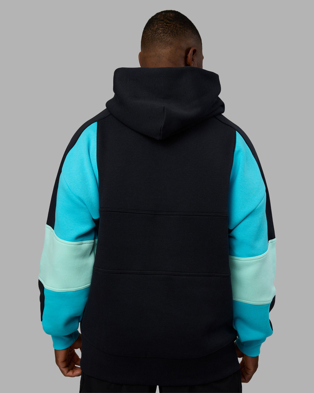 Man wearing Slam Oversized Hoodie - Caviar-Blue Atoll | Model:Sam | Size:L