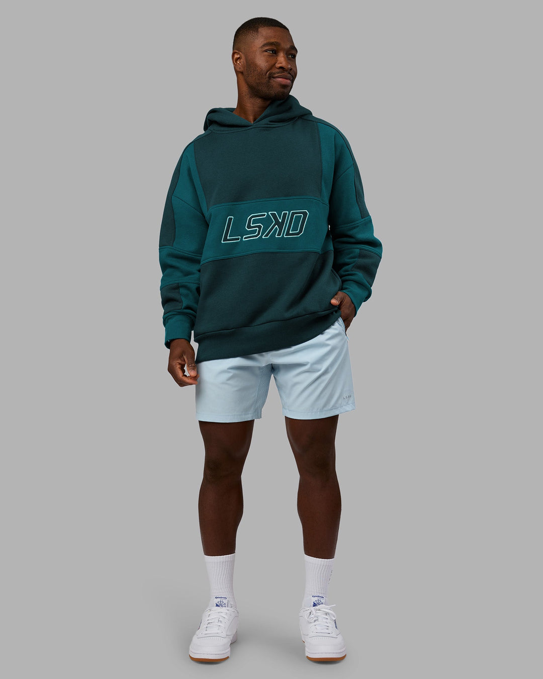 Man wearing Slam Oversized Hoodie - Deep Sea-Blue Coral | Model:Sam | Size:L