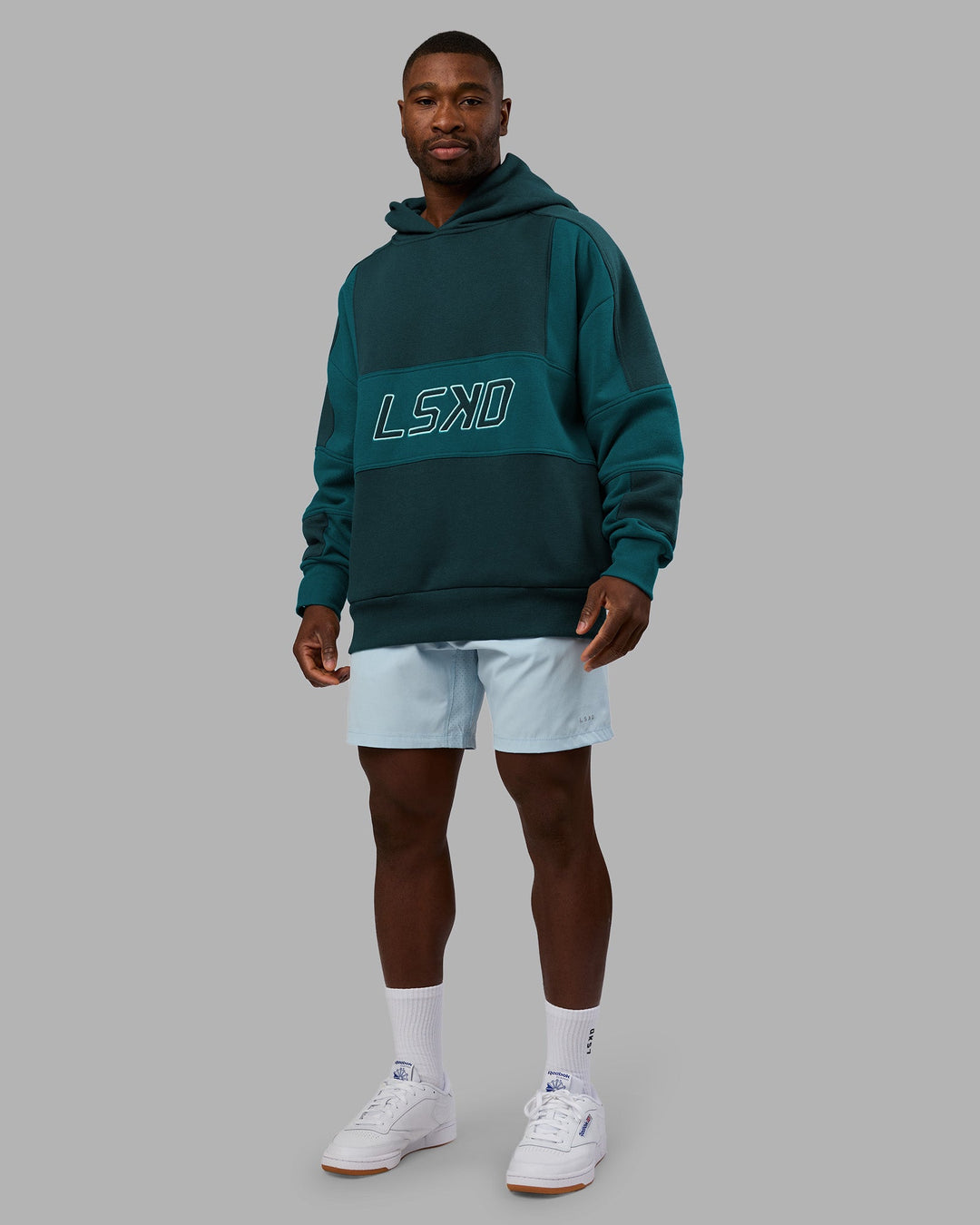 Man wearing Slam Oversized Hoodie - Deep Sea-Blue Coral | Model:Sam | Size:L