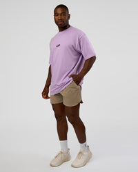 Man wearing Standard Issue FLXCotton Oversized Tee - Pale Lilac-Black | Model:Sam | Size:L