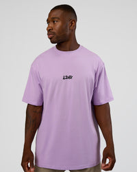 Man wearing Standard Issue FLXCotton Oversized Tee - Pale Lilac-Black | Model:Sam | Size:L