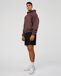 Man wearing Static Grit Unisex Boxy Hoodie - Cocoa Powder-Hot Chocolate | Model:Jackson | Size:L