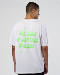 Man wearing Together We Rise FLXCotton Oversized Tee - White-Solar Lime | Model:Zoran | Size:L