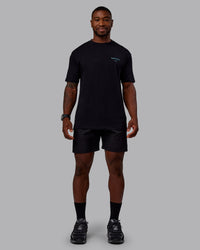 Man wearing Trust The Process 2.0 FLXCotton Tee Oversize - Black-Blue Atoll | Model:Sam | Size:L