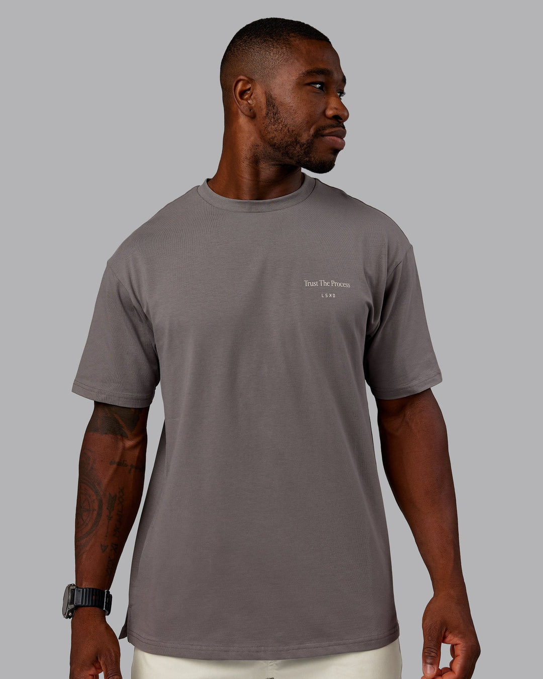 Man wearing Trust The Process 2.0 FLXCotton Tee Oversize - Storm Front-Shale Beige | Model:Sam | Size:L