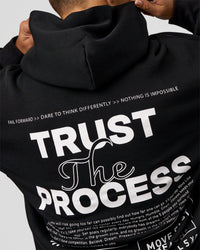 Man wearing Trust The Process Unisex Oversized Hoodie - Black-White | Model:Jaiden | Size:L