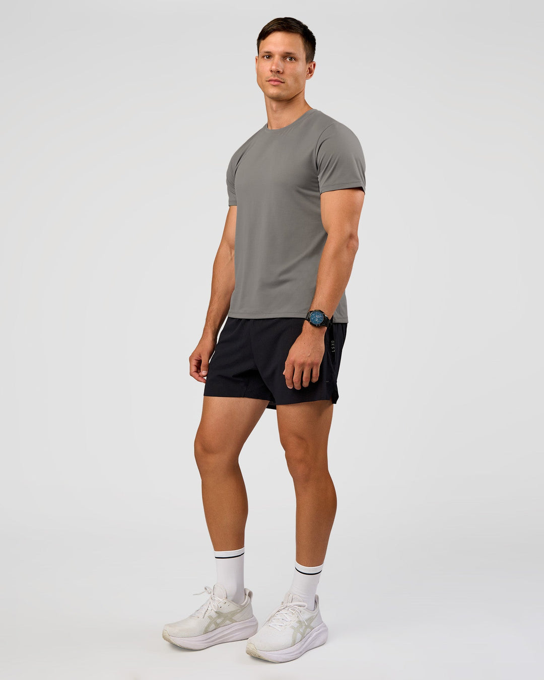 Man wearing UltraAir 5" Lined Performance Short  - Black-Reflective | Model:Liam | Size:L - view 9