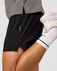 Man wearing UltraAir 5" Lined Performance Short  - Black-Reflective | Model:Liam | Size:L | Thumbnail Index: 1