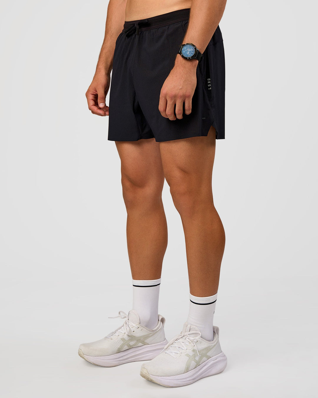 Man wearing UltraAir 5" Lined Performance Short  - Black-Reflective | Model:Liam | Size:L - view 7