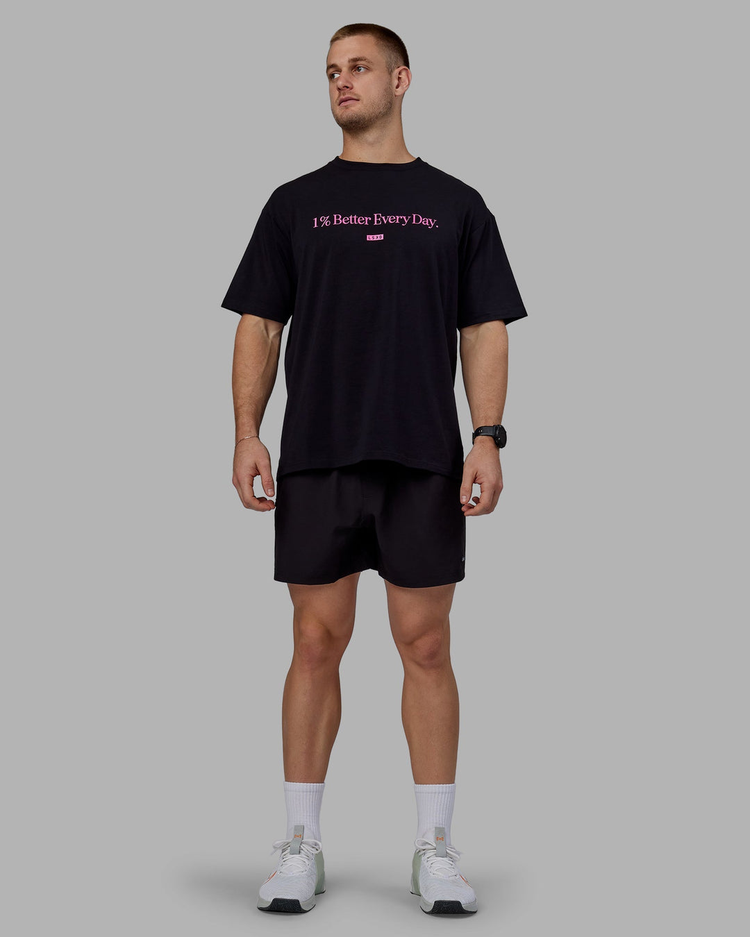 Man wearing Unisex 1% Better FLXCotton Tee Oversize - Black-Fuschia Pink