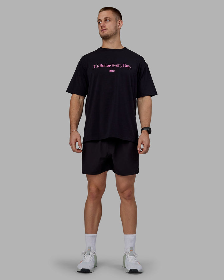 Man wearing Unisex 1% Better FLXCotton Tee Oversize - Black-Fuschia Pink
