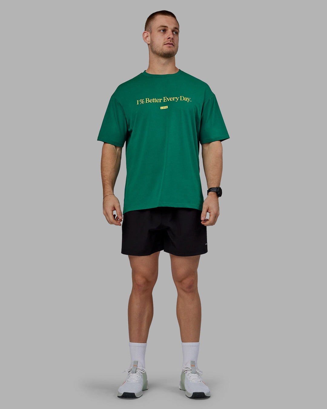 Man wearing Unisex 1% Better FLXCotton Tee Oversize - Green-Gold