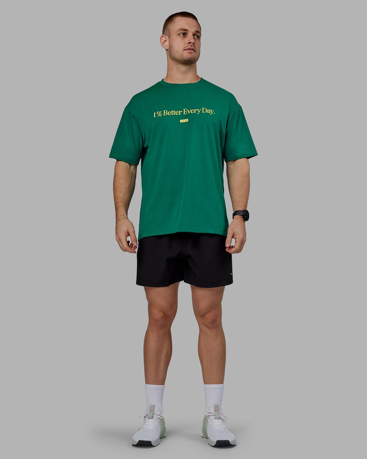 Man wearing Unisex 1% Better FLXCotton Tee Oversize - Green-Gold
