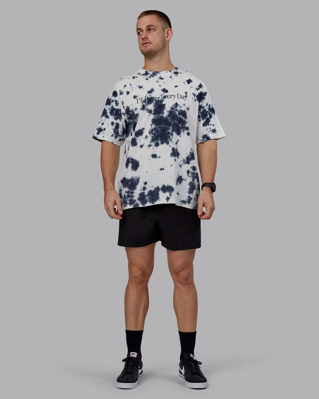 Man wearing Unisex 1% Better Heavyweight Oversize Tee - White-Black Tie Dye