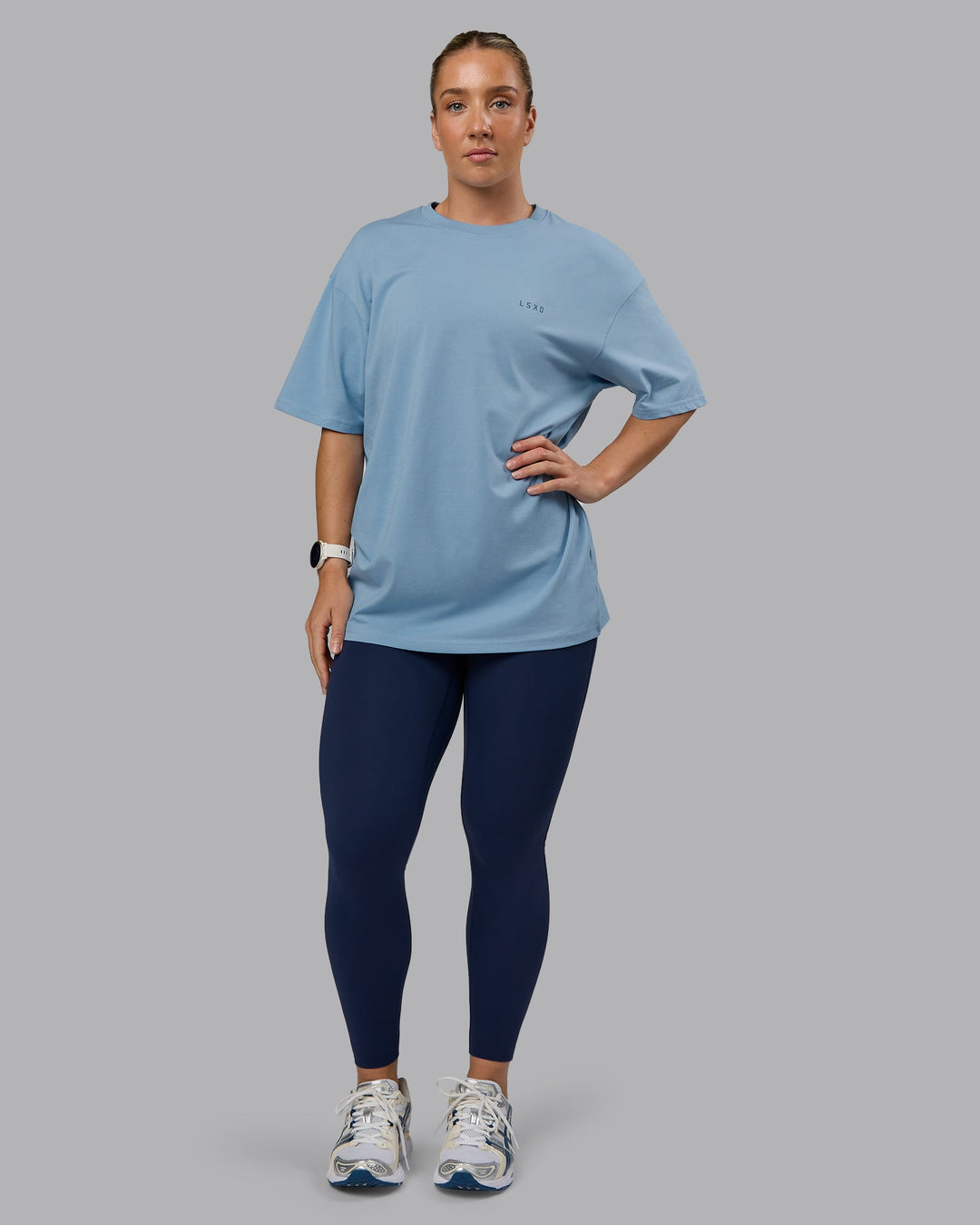 Woman wearing Unisex 1% Better Value Series FLXCotton Tee Oversize - Glacier Lake-Indigo