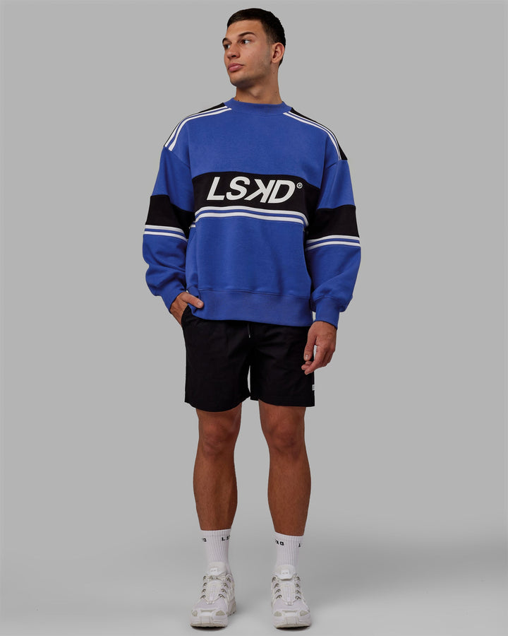 Man wearing Unisex A-Team Sweater Oversize - Power Cobalt-Black
