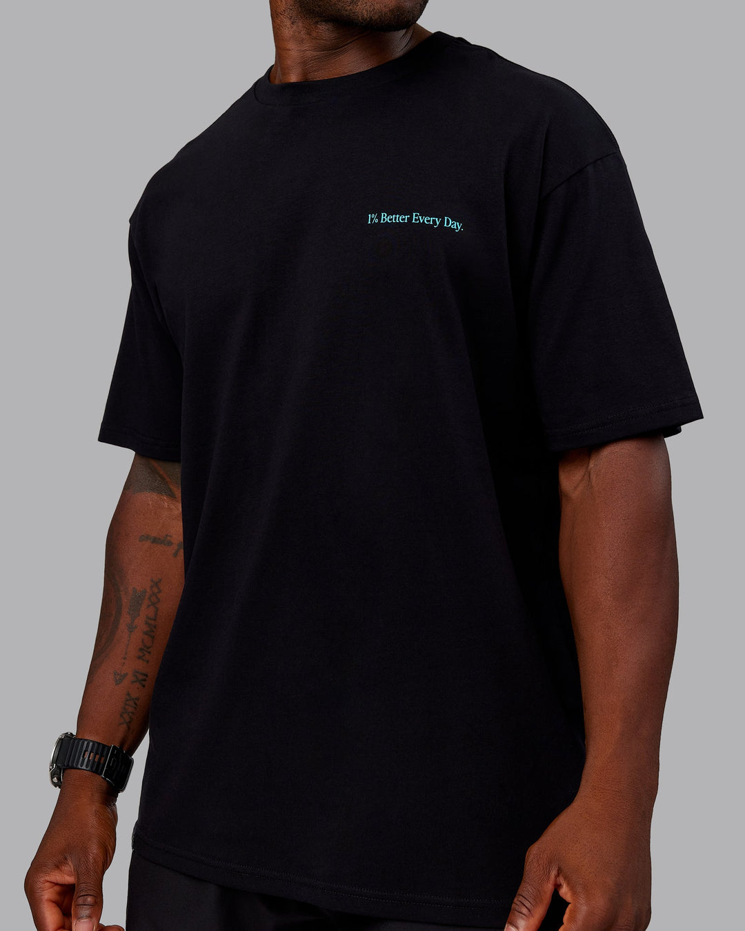 Man wearing Better Every Day FLXCotton Tee Oversize in Black-Blue Atoll | Size:L | Model:Sam