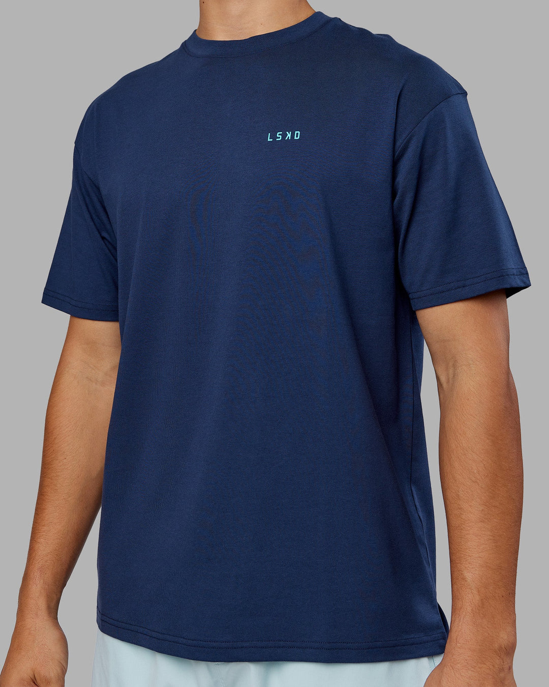 Man wearing Enjoy the Journey Value Series FLXCotton Tee Oversize - Future Navy-Blue Atoll | Model:Jackson | Size:L